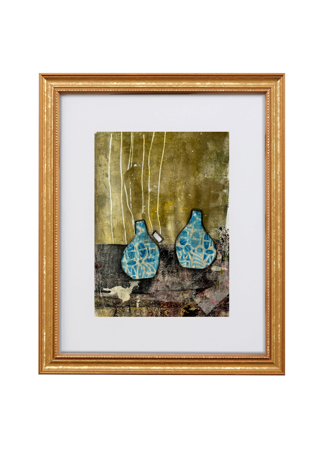 Framed abstract art print featuring two blue patterned vase-like forms against a textured gold and brown background, presented in a gold frame with a white mat on a white background.